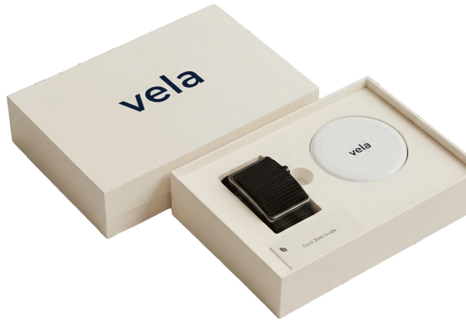 Sentir box contents — band, magnetic charging dock, and quick start guide